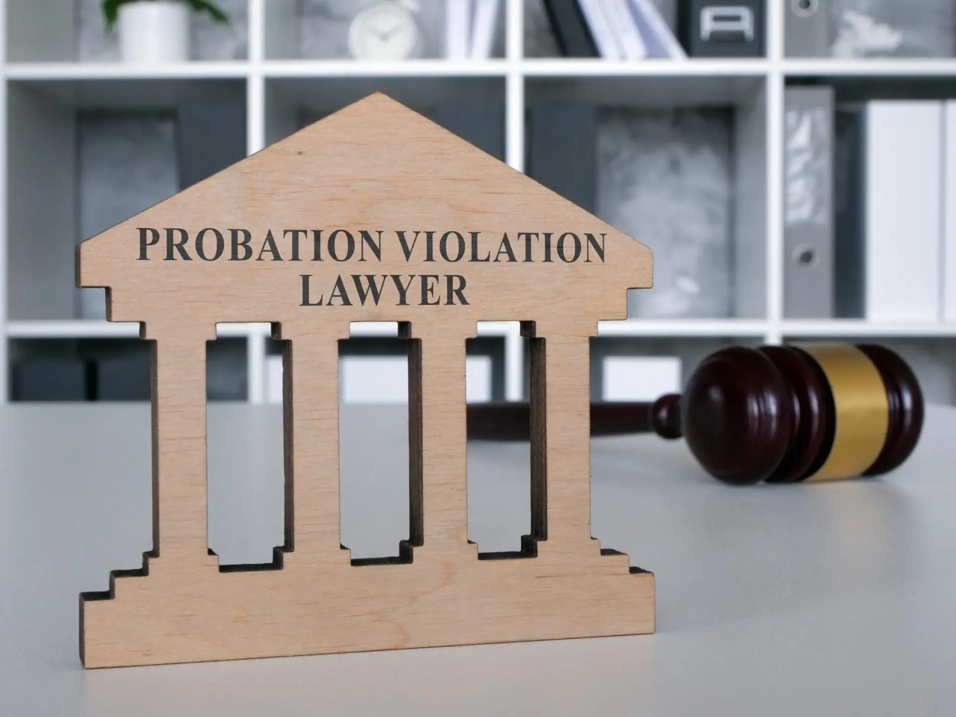 Desk with plate probation violation lawyer and gavel