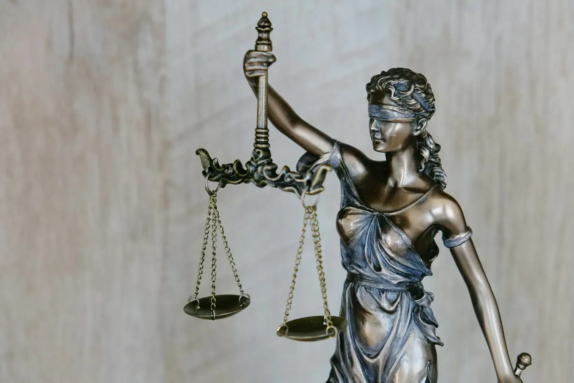 Symbolic image of justice scales and legal defense against criminal charges